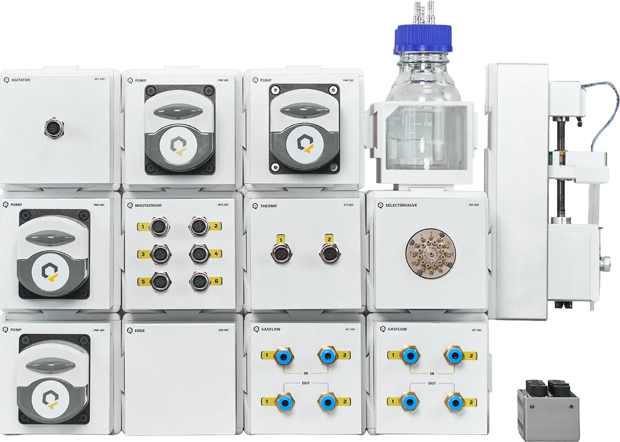 A QB system built from QB Modules: pumps, sensors, gas control, a selector valve, a syringe pump and a glass vessel